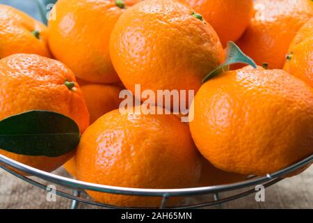 Tangerines with leaves close-up. Stock Photo