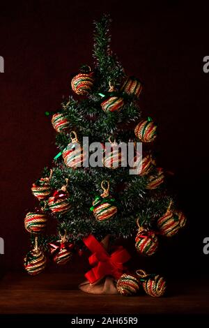 Christmas tree Christmas still life with handmade spheres on wooden background Stock Photo