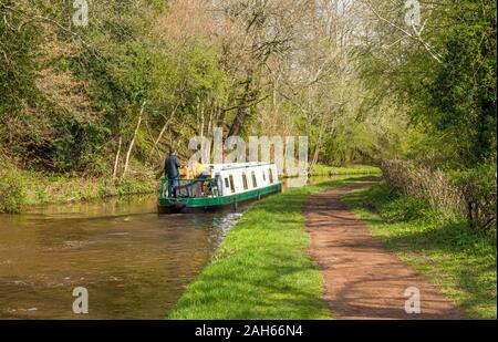 A narrowboat on the Brecon and Monmouthshire canal in the Brecon Beacons south Wales. It is April and Spring has arrived here. Stock Photo