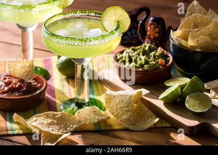 Margaritas with nachos and guacamole. Stock Photo