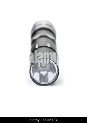 Old black flashlight isolated on white background Stock Photo