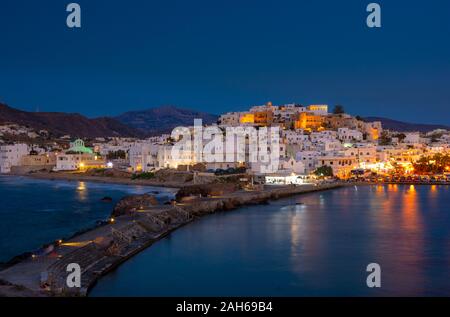Chora of Naxos island as seen from the famous landmark the Portara with the natural stone walkway towards the village, Cyclades, Greece. Stock Photo