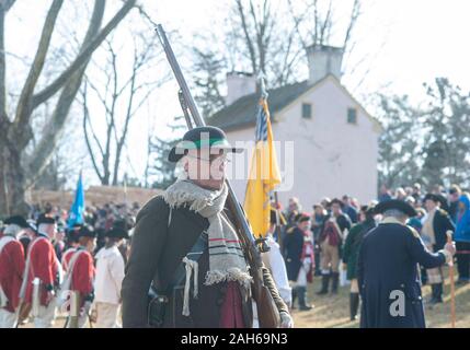 Washington Crossing, Pennsylvania, USA. 25th Dec, 2019. Soldiers march as they ready to go to their boats during the official Christmas Day Crossing of the Delaware reenactment by George Washington and his troops  Wednesday, December 25, 2019 at Washington Crossing State Park in Washington Crossing, Pennsylvania. (WILLIAM THOMAS CAIN / PHOTOJOURNALIST) Credit: William Thomas Cain/Alamy Live News Stock Photo