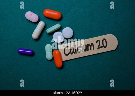 Calcium 20 write on stick note isolated on Office Desk. Medical concept Stock Photo