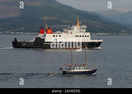 Tregella, a privately-owned sailing vessel, and Caledonian MacBrayne's car ferry MV Bute, off Gourock on the Firth of Clyde. Stock Photo