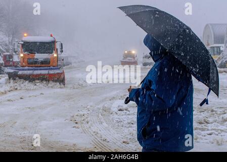 (191226) -- BEIJING, Dec. 26, 2019 (Xinhua) -- A man stands on the muddy snowy road in Mount Hermon in the Israeli-annexed Golan Heights as the first snowfall of the winter hit Golan Heights on Dec. 25, 2019. (Ayal Margolin/JINI via Xinhua) Stock Photo