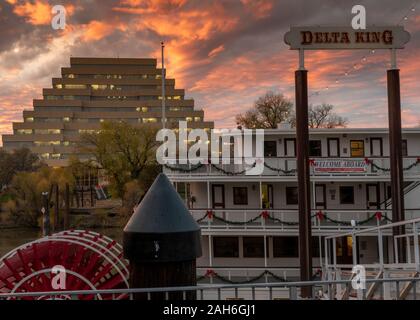 Sacramento, CA, Dec 12, 2019. View of the Zigurat Building and  Delta King riverboat Hotel in the sunset, Old Sacramento, USA Stock Photo