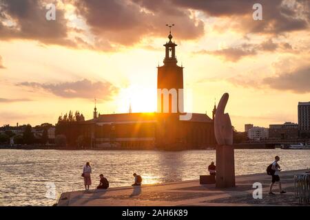 Sunset along harbor behind City Hall, Stockholm, Sweden Stock Photo