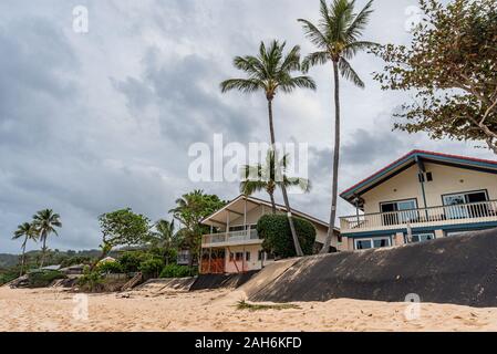 Sunset Beach, Hawaii/USA- Dec. 24, 2019: Loss of yards and homes due to beach erosion on Sunset Beach, Oahu, Hawaii Stock Photo