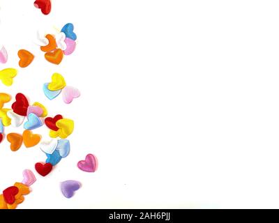 Multi-colored hearts on a white background for Valentine's Day with a place for text. Holidays. Free place. Postcard. Stock Photo