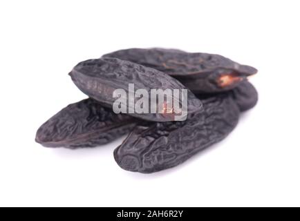 Tonka beans isolated on white background. Bean of Dipteryx odorata, cumaru or kumaru. Fresh aroma tonka beans Stock Photo