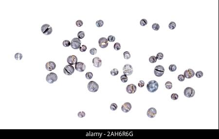 Split shot lead weights for fishing, sinkers. Macro, isolated on white background. Stock Photo