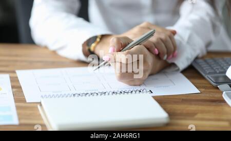 Female writing down in schedule Stock Photo