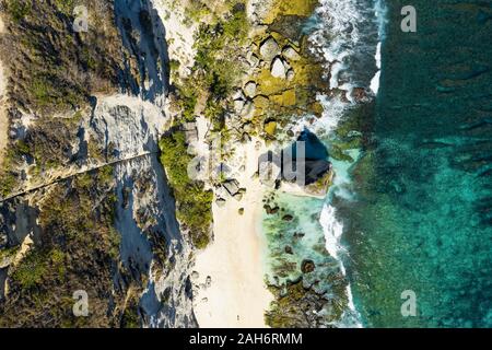 View from above, stunning aerial view of the beautiful Diamond Beach bathed by a turquoise sea. Stock Photo