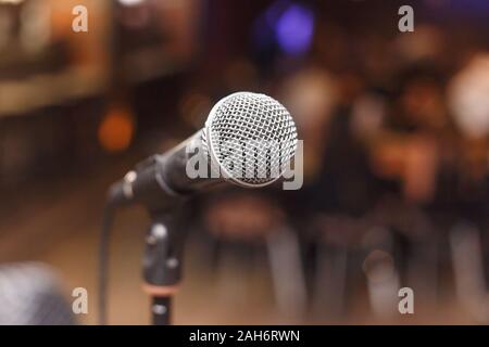 Microphone in a bar stage, blurred background Stock Photo