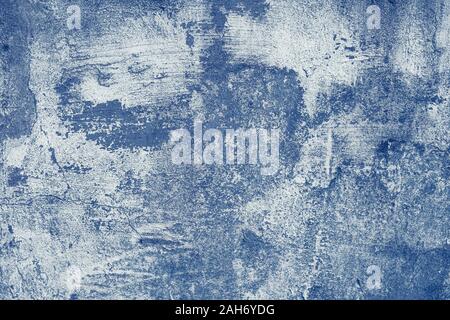 Abstract grunge background with peeling paint. Concrete stone wall, texture. Shabby stucco, blue pattern. Vintage, old cement. Building architecture Stock Photo