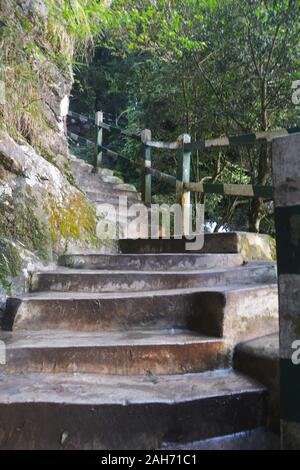 Close up of the stairs going up with safety railings mage of concrete pillars in Elephant Falls of Shillong, selective focusing Stock Photo