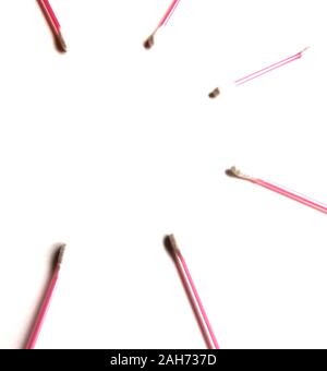 Pink Cotton swabs on a white isolated background. Place for text. View from above. Ear sticks. Stock Photo