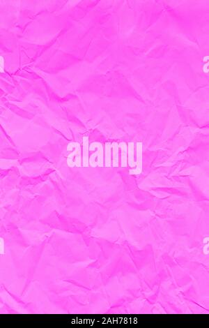 Pink crumpled wrinkled textured paper background. Copy space Stock Photo