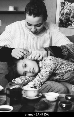 mother with her beloved daughter resting in coffee Stock Photo