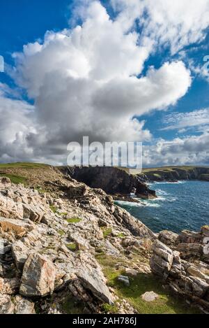 Rocks under blue sky with clouds. View of mountain valley. Tourism ...