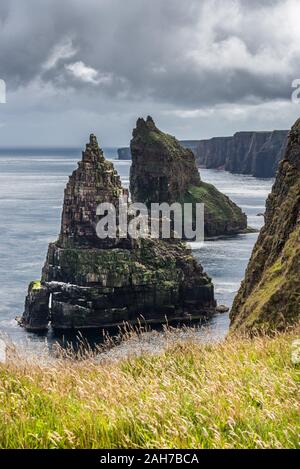 Close up of the Duncansby Stacks under a cloudy sky in a late afternoon summer day Stock Photo