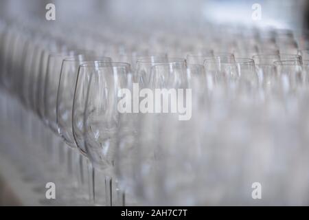 Close up of a series of rows of chalices lined for a wedding party Stock Photo