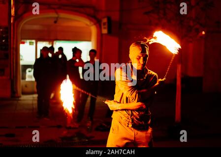 The guy on the street turns a torch of fire Stock Photo