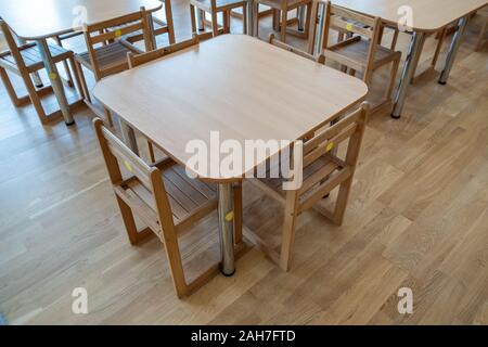 Kyiv, Ukraine - October 14, 2019: Interior of a spacious kindergarten room with small children tables and chairs. Stock Photo