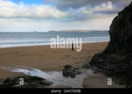 Carbis Bay (aka Barrepta Cove), and the view across St. Ives' Bay to Godrevy Point, Cornwall: walking the dog at low tide Stock Photo