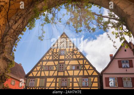 Colorful half-timbered houses with gable roof in Dinkelsbuhl, Central Franconia, Bavaria, Germany, a popular travel destination on Romantic Road touri Stock Photo