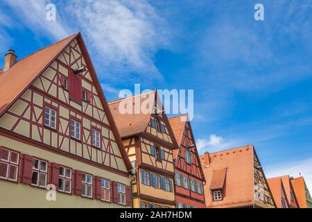 Colorful half-timbered houses with tiled gable roof in Dinkelsbuhl, Central Franconia, Bavaria, Germany, a popular travel destination on Romantic Road Stock Photo