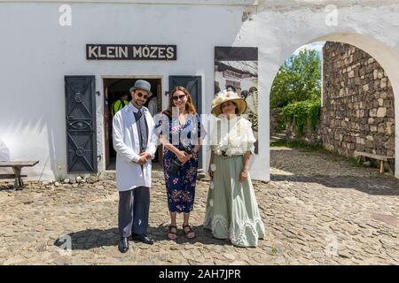 Szentendre, Hungary - July 01 2018: Tourist with jew pharmacist and old fashion lady. Stock Photo