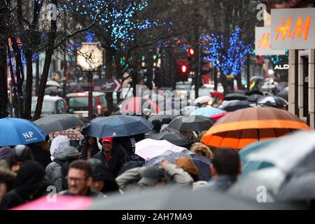 London, UK. 26th Dec, 2019. Crowds brave the rain for the Boxing Day sales under a sea of umbrellas, Oxford Street, London Credit: Paul Brown/Alamy Live News Stock Photo