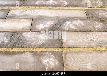 Colorful mixed background made of stoned blocks, wooden boards and sand. Exterior background texture. Rustic background Stock Photo