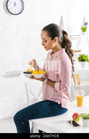 happy girl holding food container with vegetables Stock Photo