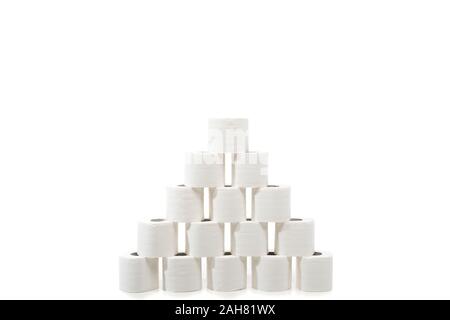 rolls of toilet paper arranged in pyramid isolated on white Stock Photo