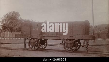 Jamaica, An open railway wagon inscribed 'J.R. No.128', sits on rails at a siding, 1894-1895. 1999/221/1/62/72. Stock Photo