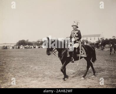 South Africa, The Duke of Connaught, dressed in full military regalia, rides out to review British Army troops based in South Africa at Green Point Common. Cape Town, 1 November 1910.Notes from a printed itinerary of the visit:Tuesday, November 1Morning. Constantia, Visit to Government Wine Farm. 5 P.M. Green Point Common, Review. 8 P.M. Government House, Private Dinner, 1910. 1995/076/1/4/1/19. Stock Photo