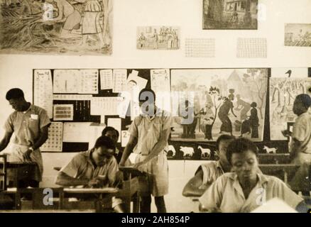 Gold CoastGhana, Male students work at their desks during an art class at a teacher training college.Original manuscript caption: An art class at a men's teacher training college, Ashanti, 1951-52. 1995/076/5/2/2/34. Stock Photo