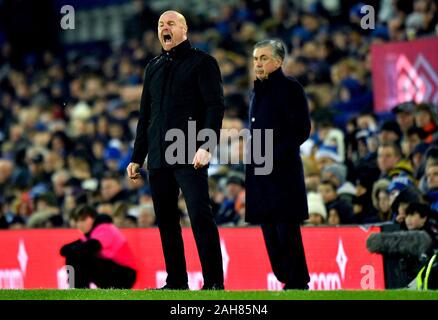 Burnley manager Sean Dyche (left) shouts from the touchline during the Premier League match at Goodison Park, Liverpool. Stock Photo