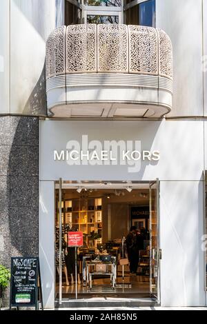 Michael Kors store in Shibuya, Tokyo. Close up of ground floor entrance  looking into the shop with women's handbags on sale with red sale sign  Stock Photo - Alamy
