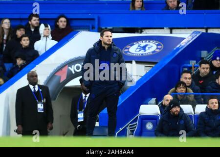 Chelsea's head coach Frank Lampard gives his autograph to fans after a ...