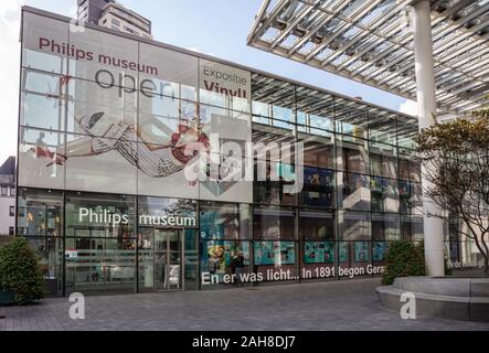 Eindhoven, Netherlands. October 10, 2019. The glass entrance of Philips Museum. The poster inform the visitors that the audio exhibition is open. Stock Photo