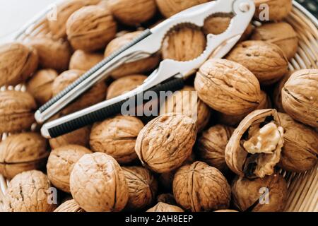 Nutcracker and walnuts in a large bowl Stock Photo