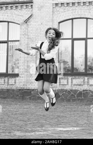 Feeling comfy. Girl wear fashionable outfit. White shirt and black dress. Formal  clothes for visiting school. Daily outfit. Adorable schoolgirl. Perfect  matching clothes. Kids clothes. School fashion Stock Photo - Alamy