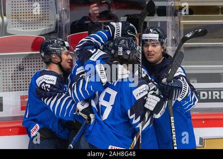 Trinec, Czech Republic. 26th Dec, 2019. Finnish players celebrate the first goal during the 2020 IIHF World Junior Ice Hockey Championships Group A match between Sweden and Finland in Trinec, Czech Republic, on December 26, 2019. Credit: Vladimir Prycek/CTK Photo/Alamy Live News Stock Photo