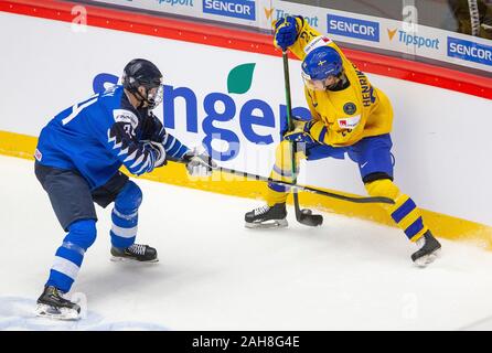 Trinec, Czech Republic. 26th Dec, 2019. L-R Aatu Raty (FIN) and Karl Henriksson (SWE) in action during the 2020 IIHF World Junior Ice Hockey Championships Group A match between Sweden and Finland in Trinec, Czech Republic, on December 26, 2019. Credit: Vladimir Prycek/CTK Photo/Alamy Live News Stock Photo