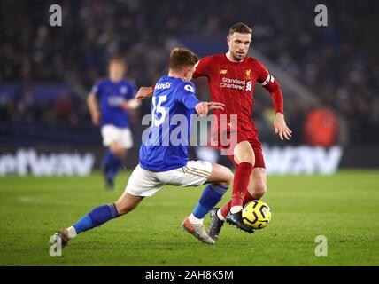 Liverpool's Jordan Henderson (right) and Leicester City's Harvey Barnes battle for the ball during the Premier League match at the King Power Stadium, Leicester. Stock Photo