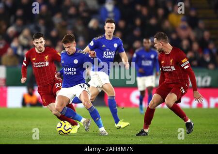 Liverpool's Andrew Robertson (left) and Leicester City's Harvey Barnes battle for the ball during the Premier League match at the King Power Stadium, Leicester. Stock Photo